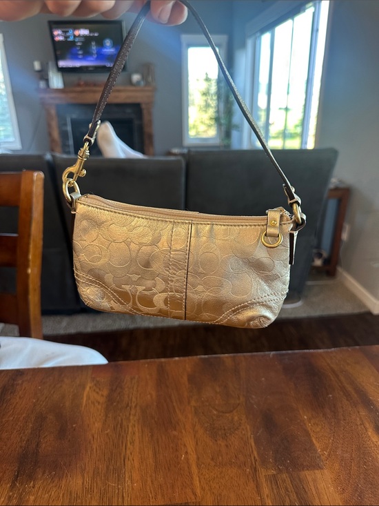 Coach Handbags - Coach Gold Metallic Signature Mini Wristlet